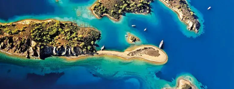 Traditional gulet anchored in calm turquoise bay